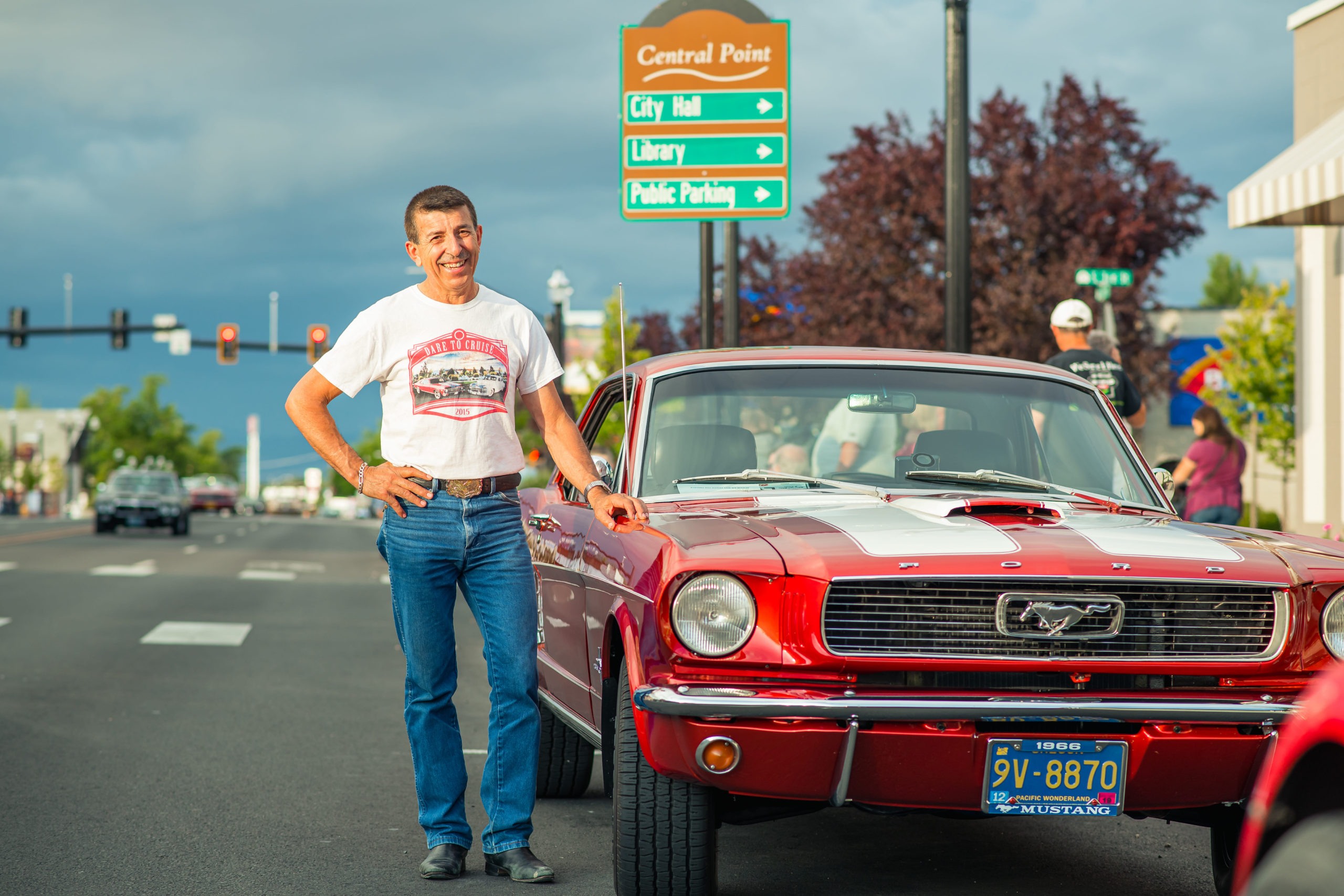 classic car cruise, man posing with car downtown